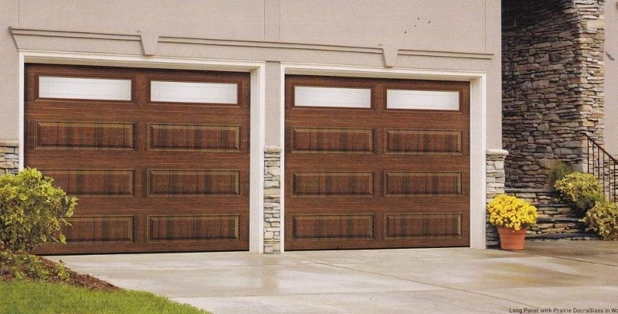 A garage door that is brown and has windows.